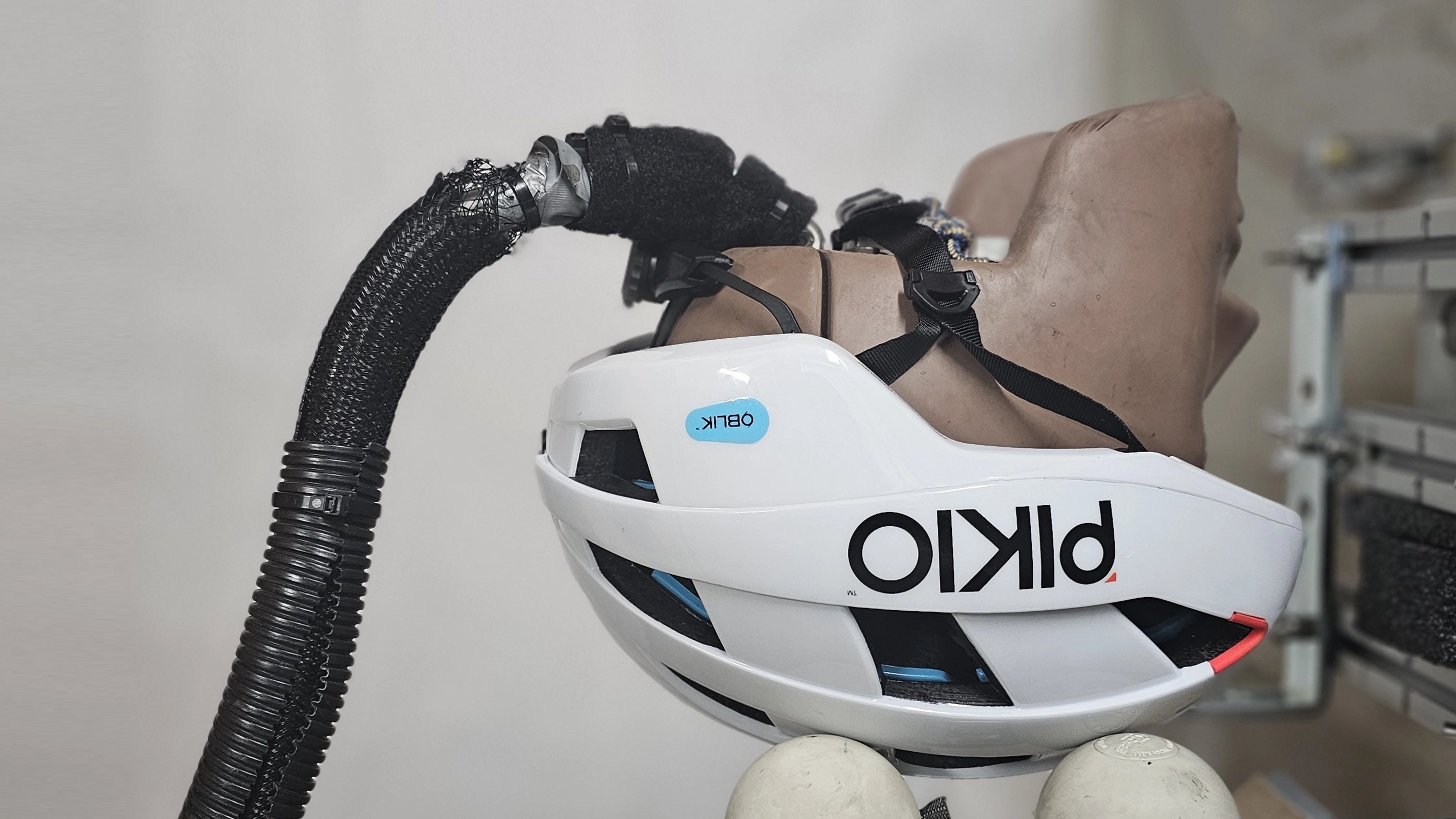 The PIKIO Si Helmet, equipped with the OBLIK impact management system, is being tested at PIKIO LABS' advanced testing facilities using a Hybrid III headform.