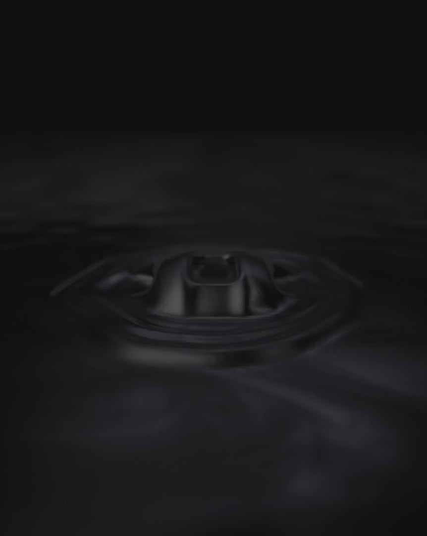 Load video: PIKIO Si helmet emerging from liquid metal, revealing a shattered metallic shell and rotating X-ray view of its internal structure.